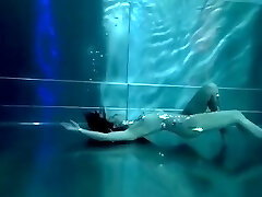 Bond Girl, underwater stunts, nerd lady, high heels glamor and underwater swimming retro style 
