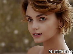 Gorgeous redhead teases with her natural globes and soft pussy