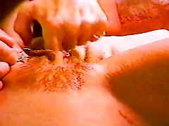 A one of a kind pierced babe steaming her pussy lips stretched