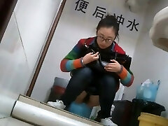 Nerdy chinese damsel caught taking a leak