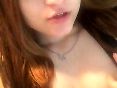 Redhead Asian masturbates her twat with fingers and cums