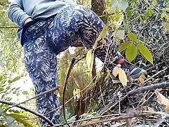 Bodacious MILF with humungous belly and huge ass in leggings masturbates outdoors