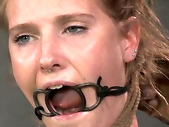 Towheaded slave with a ring gag in her gullet is bounded and punished
