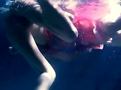 Two hot lesbos underwater touching eachother