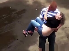 Drunk chick peeing in the parking