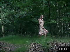 Skinny female fucks herself hard in the forest