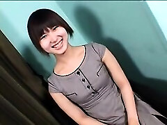 Seductive Asian shemale with a cute smile sensually drops he
