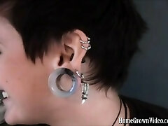 Heavily pierced and tattooed dark-haired Isabell is chatting