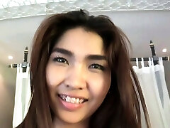 Big boob Tittiporn sucks a hard wood