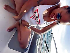 Latina wife pissing on the boat - tits out and lots of piss squirting out of her pussy