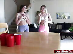 A lesbian couple loses a strip-pong game and fucks the camera man