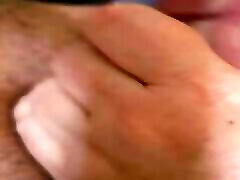 Horny slut giving handjob