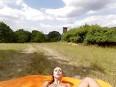 Solo Ornela Morgan naked outside on the green grass enjoying a sunny day in VR.