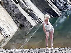 German hot milf unpacks her huge tits outdoors at the request of user at ErotikOnly!