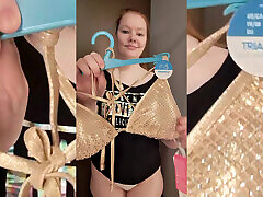 Try on - golden swimsuit in the fitting room