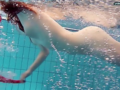 Red haired girl Libuse swimming in a pas to pornhub video in fire red dress