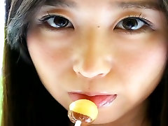 Depraved Asian hottie Yumi Ishikawa licks two lollipops