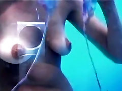 Sweet bimbo is undressing in the change beach cabin