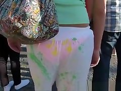 Girl in sheer pants walking on the bridge.