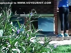 Neighbor strolls out in her black tights