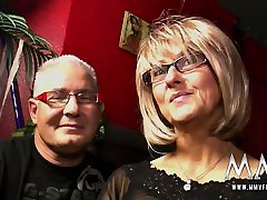 The horny swingers grab a drink at the bar before going