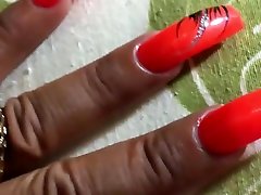 Latina with sexy long orange nails fingernails