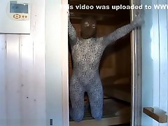 zentai girl in nylon encasament bondage room