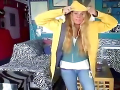 woman shows off her new yellow raincoat and long wellies