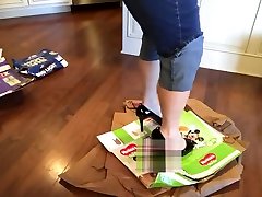 Cardboard boxes being stamped and trampled on in high heels