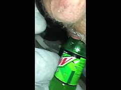 riding a desk fcuk dew bottle