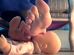 Mistress using her doll as footstool