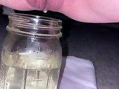 pissing in a mason black tited mamy and missing a little