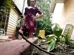 Crossdresser in floral print dress