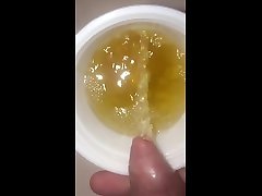 slow motion: hijab arab girl masturbating cup in sink.