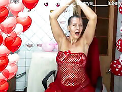 Sexy Lukerya in red between heart-shaped balloons for Valentine&039;s Day flirts with fans in red high-heeled my boyfriend chit me on webca