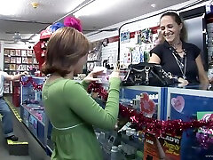 Gorgeous babe masturbates in a public movie rental store