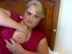Bosomy blond mom mauls her huge jugs while flirting through webcam