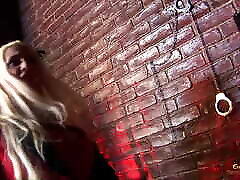 Blonde slut and her friend share a hard cock in the dungeon