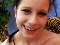 A slim German babe with dark hair loves getting fucked by a strapon