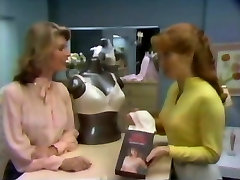 Two broads try on Playtex bras.